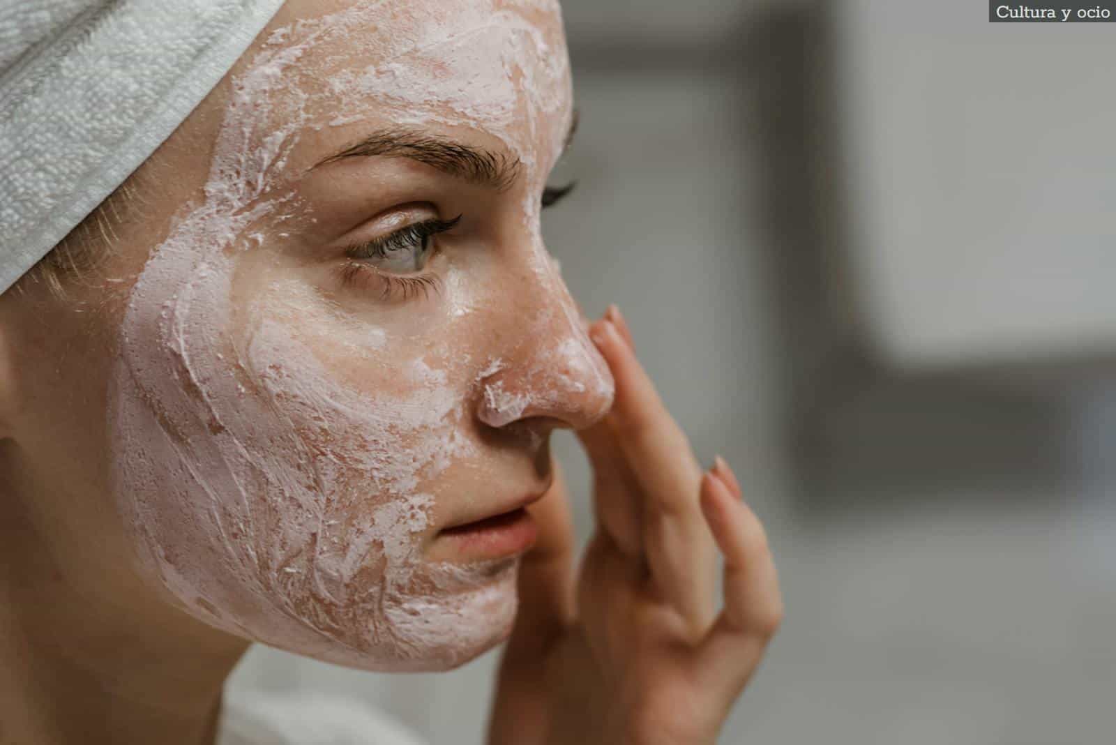 Close-up Photo of a Woman Applying Facial Cream