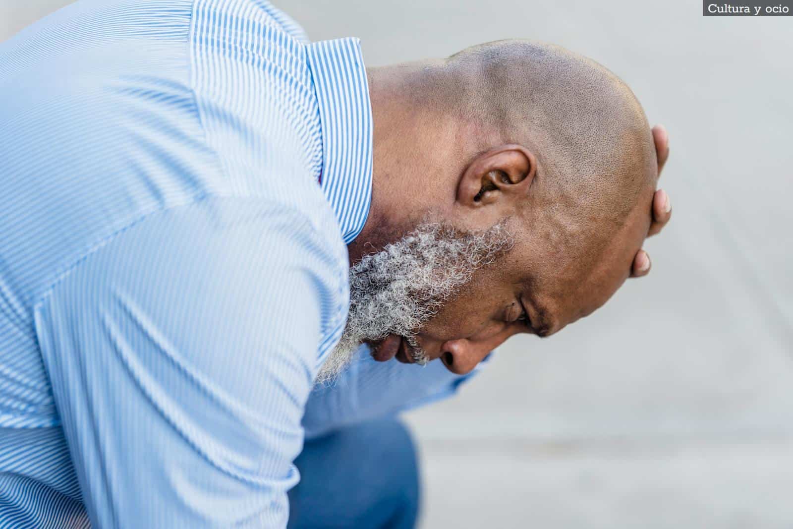 Depressed black businessman on street